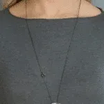 silver necklace structure with crystal