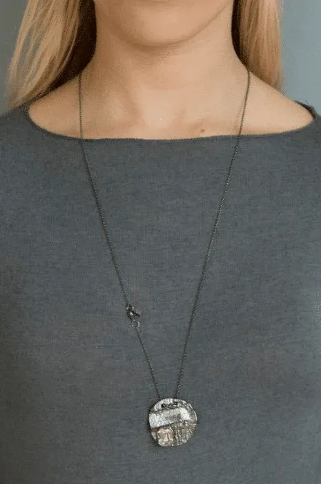 silver necklace structure with crystal