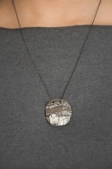 handmade round silver pendant with crystal